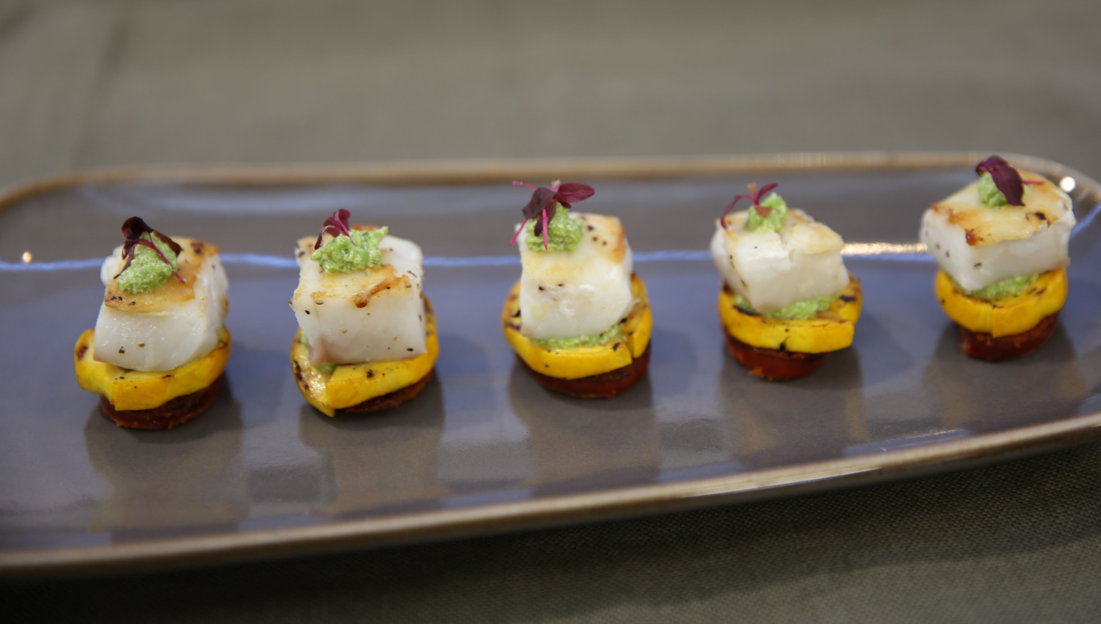 Atlantic Cod with Crispy Chorizo, Pea Purée, and Delicately Grilled Courgette